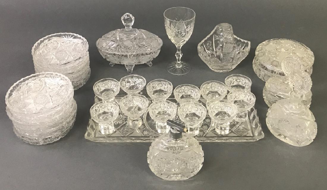 Cut Glass Tableware Grouping: Cut glass tableware to include a tray, 16"l, atomizer 5 1/2"h, twelve small wine glasses, twelve small plates, etc