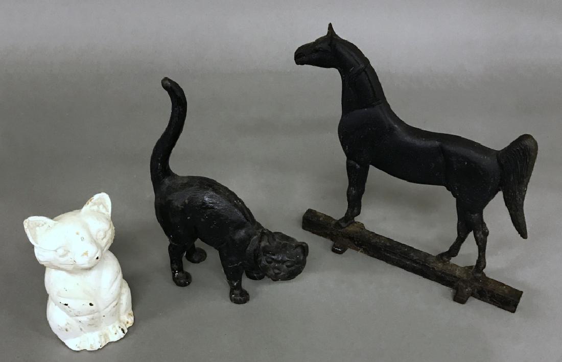 Cast Iron Stallion and Two Iron Cats: Cast iron stallion by Virginia Metal Crafters titled "King's Genius", 12"h x 13"w, together wth two iron cats