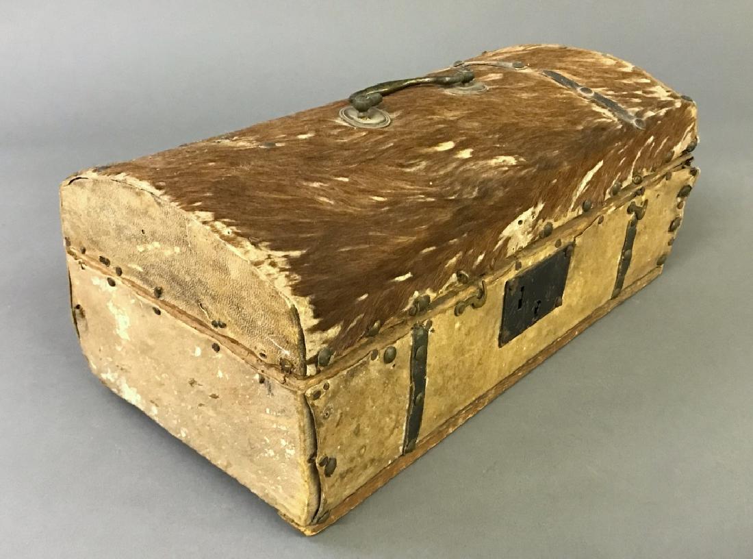 Deerskin Covered Dome Lid Box: Deerskin covered dome lid box, 19th c., with newspapered interior, 6 1/2"h x 15"w