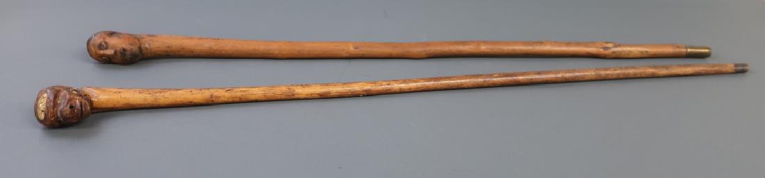 Two Folk Art Canes With Carved Faces (1 of 2)