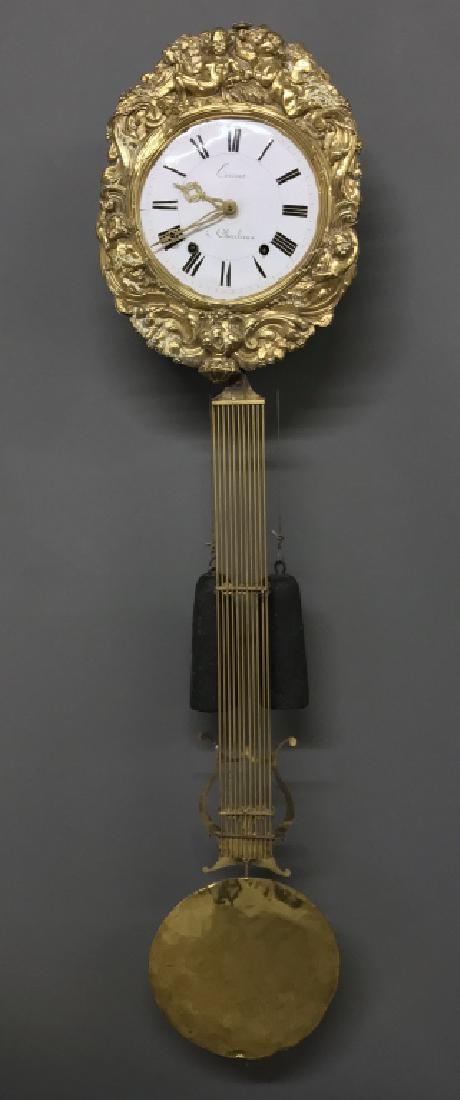 French Morbier Wall Clock: French Morbier wall clock, the porcelain dial signed "Cerrier 'a Charlieux", probably late 18th century, 17"h, overall 55"l
