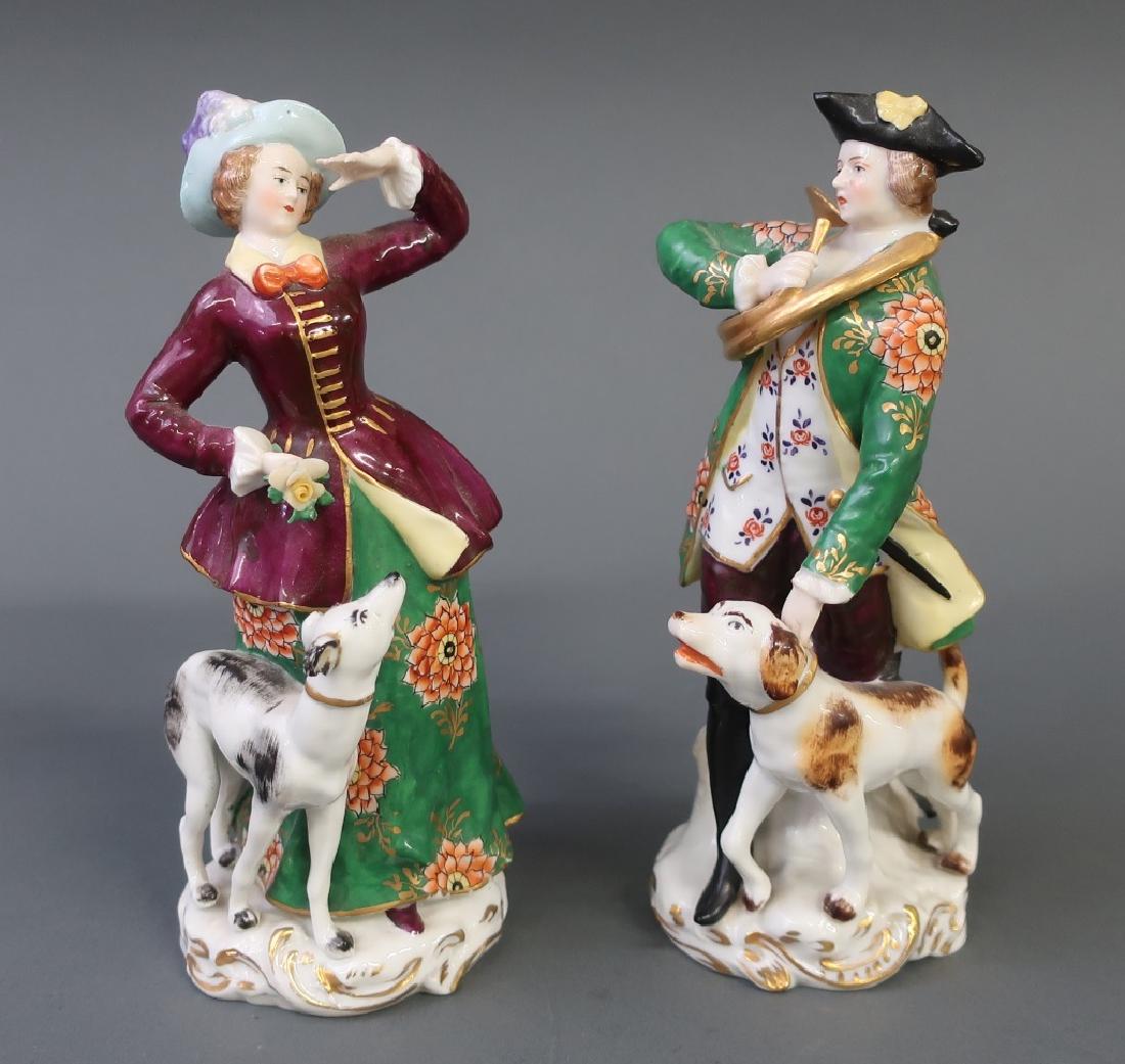 Chelsea Porcelain Figural Group: Chelsea porcelain figural group of a man and woman with dogs, circa 1920's, each 7 3/4"h x 3 1/2"w