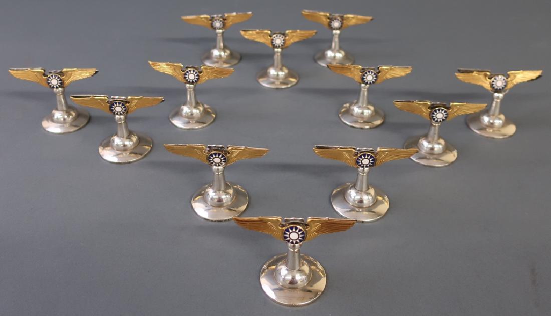 WWII U.S. 8th Air Force Reunion Place Card Holders: Twelve silverplate and enamel WWII U.S. 8th Air Force Reunion Dinner place card holders, each 2"h x 3"w