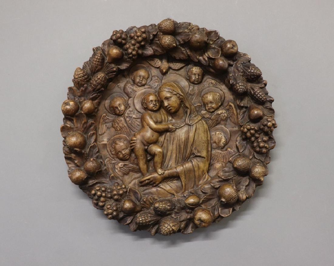 Della Robbia Plaster Madonna and Child: Plaster molded Della Robbia relief plaque of the Madonna and Child framed in a wreath of fruit and leaves, 24"dia