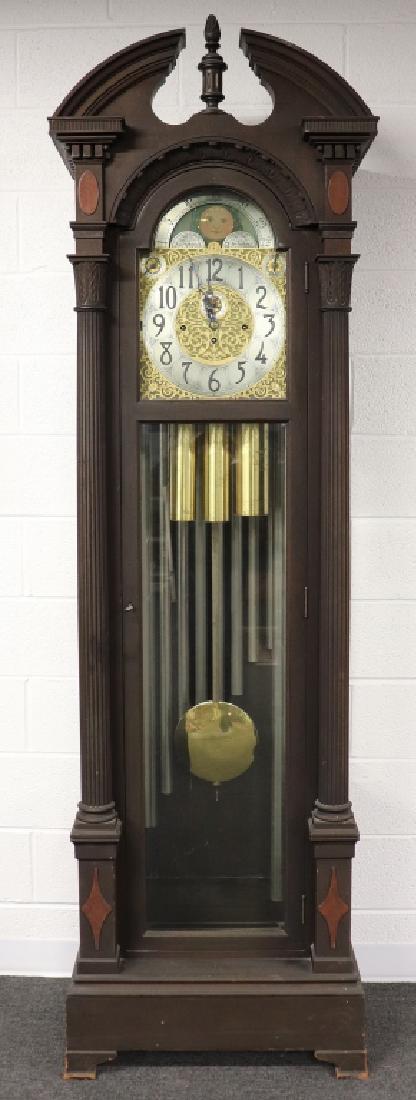 Chippendale Style Mahogany Hall Clock: Chippendale style mahogany hall clock with moon dial and nine tubular chimes; Whittington, Westminster, Canterbury chimes, marked "COLONIAL MFG. CO. 18114," 91"h W.A.I. does not guarantee clocks to be
