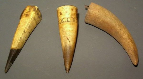 Three horn whetstone sheaths, one signed "A.E.55