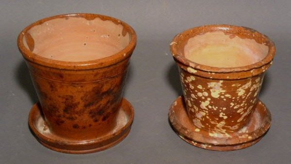 Two redware flowerpots, one with black splash ma