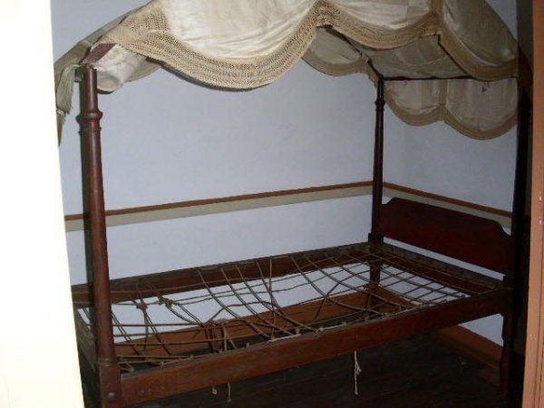 Four poster canopy bed, c.1830, rope with fabric