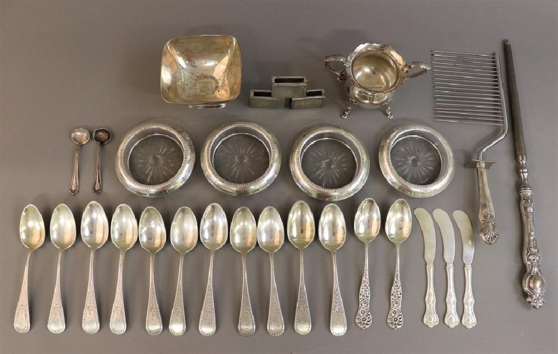 Sterling Silver Tableware and Other Items: Sterling silver items to include four glass and silver wine coasters, a sharpening tool, matchbox covers, a creamer marked, "Black, Starr, & Gorham," spoons, etc.