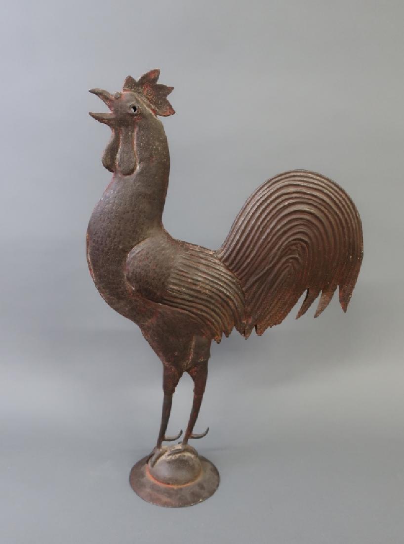 Fine Hammered Metal Crowing Rooster: Fine hammered metal standing crowing rooster, with traces of old red paint, probably late 19th century, 21 1/2"h x 14 1/2"w