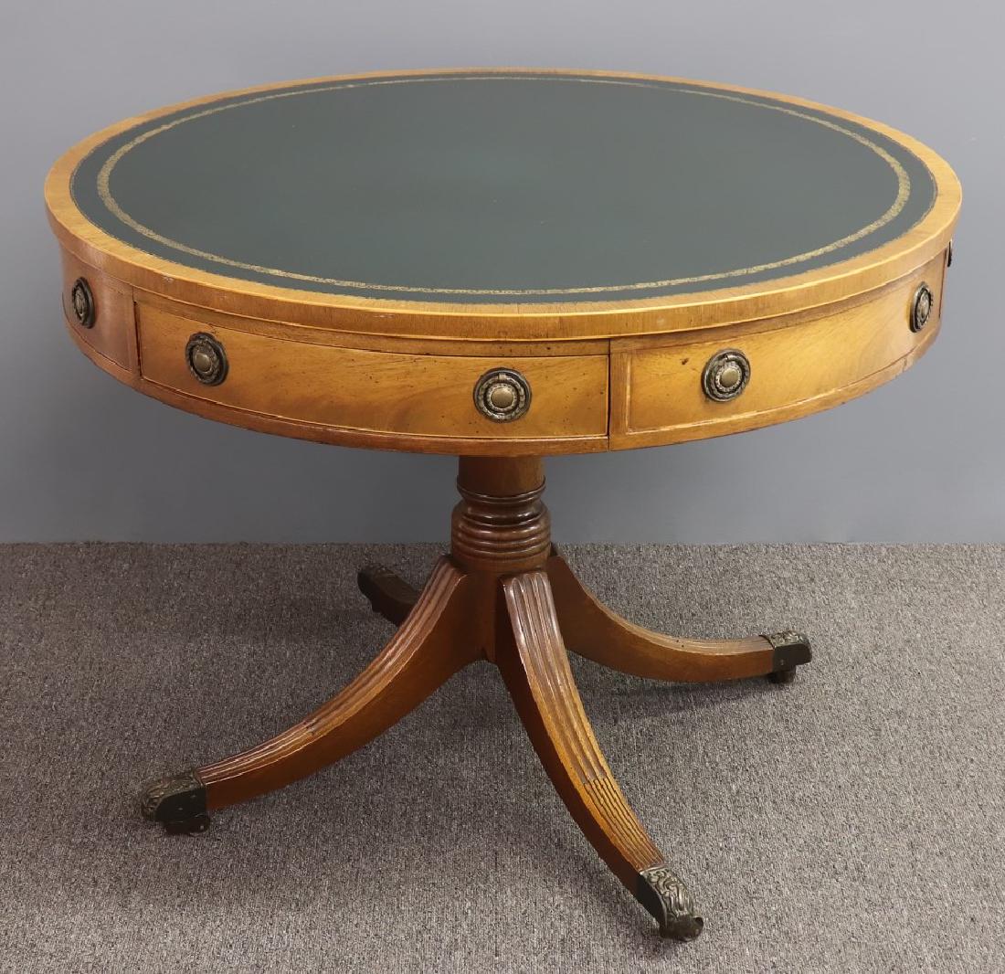 Baker Rotating Top Drum Table: Baker rotating top drum table with green leather top, reeded legs, 28"h x 36"w