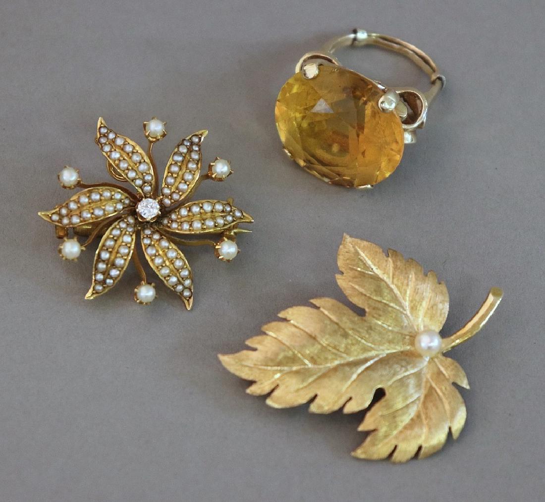 Tiffany 14K Gold Pin & a 14K Gold & Diamond Pin: A 14 Karat gold and pearl leaf form pin marked "Tiffany & Co.", 1 1/4" x 1 5/8", a 14k gold pin with seed pearls and center diamond, marked "ES", 1 1/4"dia, and an unmarked, untested ring with yellow