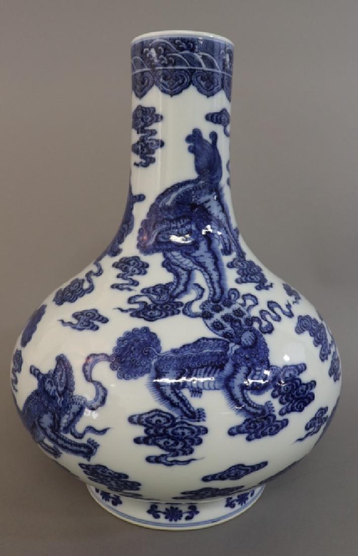 Qianlong Blue & White Vase with Foo Beasts: Qianlong blue and white vase decorated with foo dogs playing with balls, Qianlong six character reign mark underglazed on bottom, 14"h x 10 1/2"dia