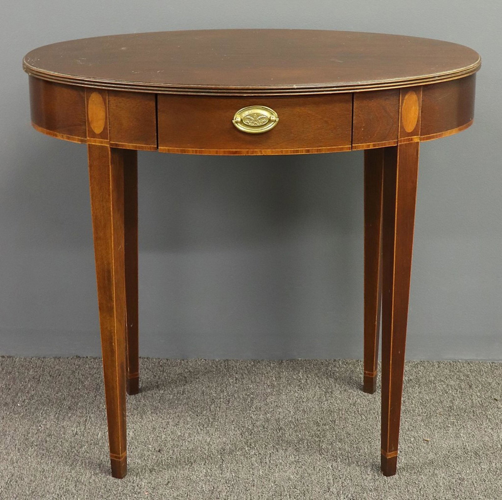 Baker Hepplewhite Style Mahogany Oval End Table: Baker Hepplewhite style mahogany oval end table, 27"h x 29 1/2"w