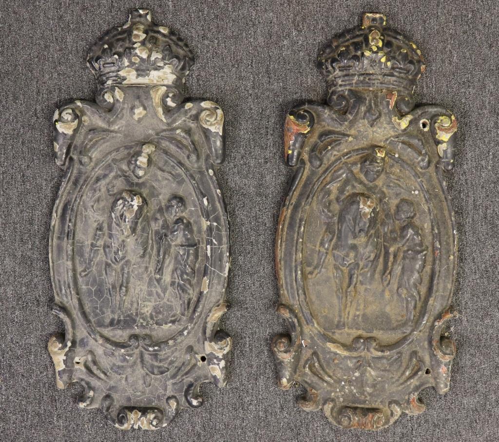 Pair of Cast Iron Raised Relief Plaques: Pair of cast iron raised relief plaques decorated with a crown above a rider on horseback with servant, 19th century, 28"h x 12"w