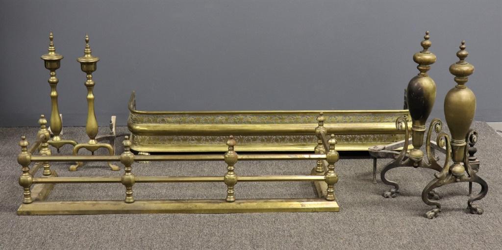 Two Brass Fireplace Fenders & Two Pair Andirons: Brass pierced / filigree fireplace fender, 8 1/2"h x 48"w x 14 12"d, together with another fender and two pair of andirons