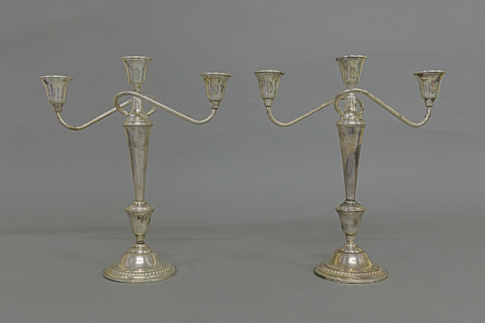 Pair of Sterling Silver Candelabra: Pair of weighted sterling silver international candelabra 12.5"H x 11"W