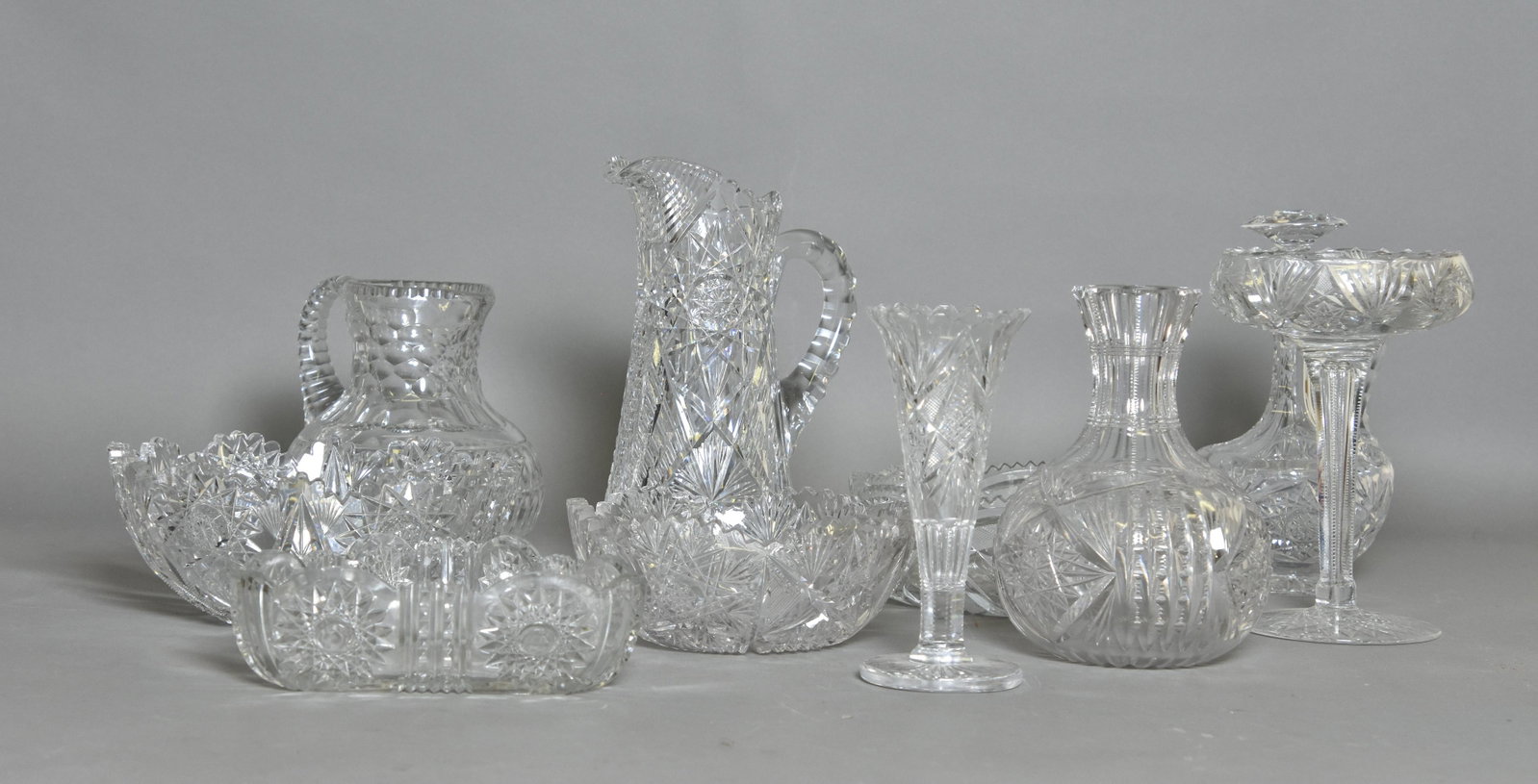 Cut Glass Tableware: Ten pieces of cut glass tableware including a pitcher 11"h (tallest) and a bowl 9.25"dia