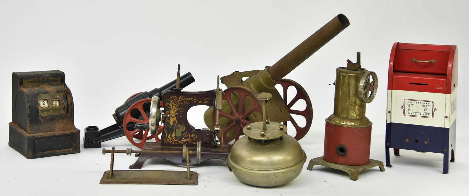 Toy Cannons etc.: Toy cannons, largest 'Big Bang' is 11.5"l; together with sewing machine, steam engine doorbell 'The Country Store", etc.