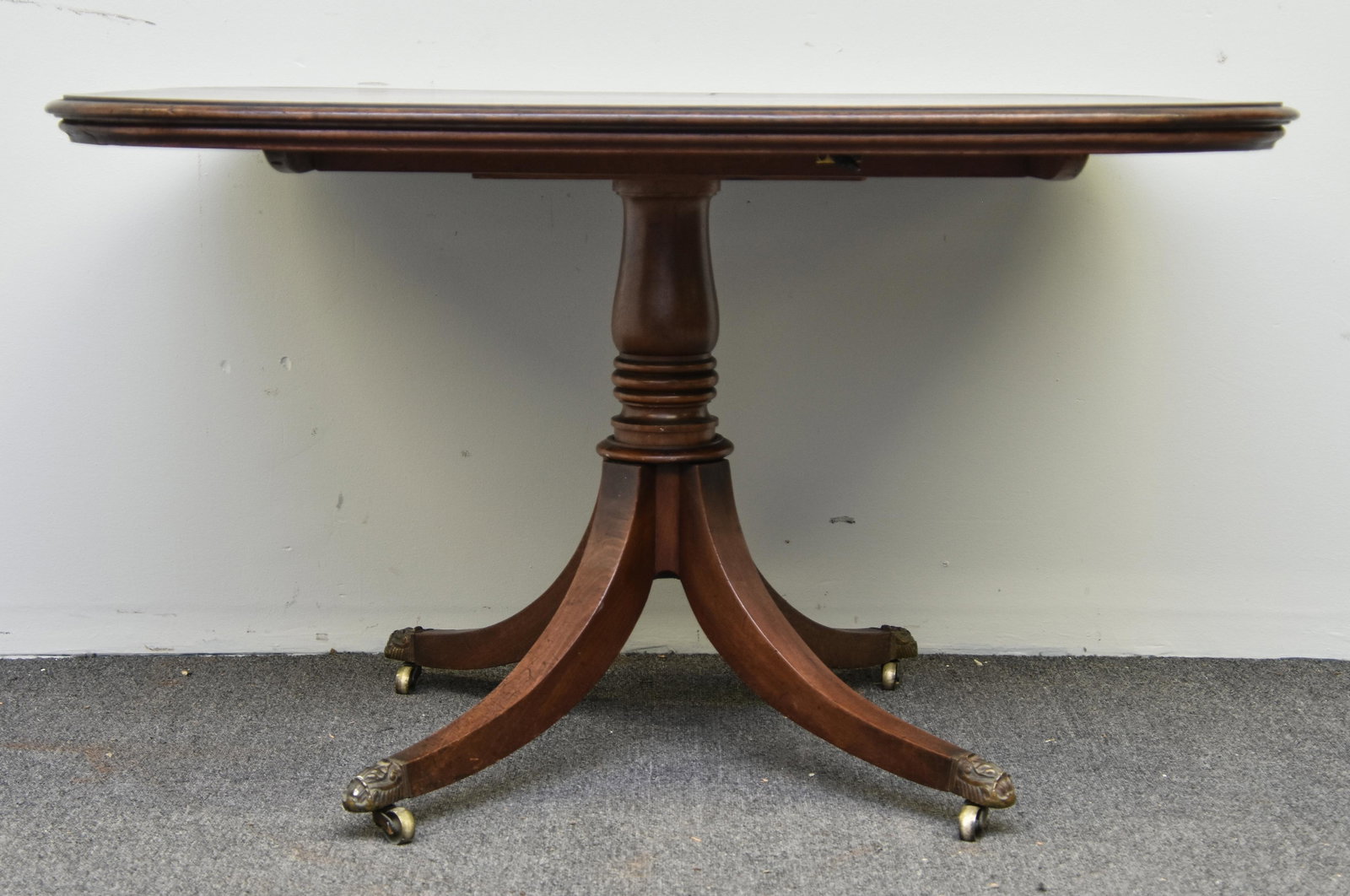 Georgian Mahogany Breakfast Table: Georgian mahogany breakfast table, circa 1790, with brass cuffs and casters 29"h x 48"w x 35"top