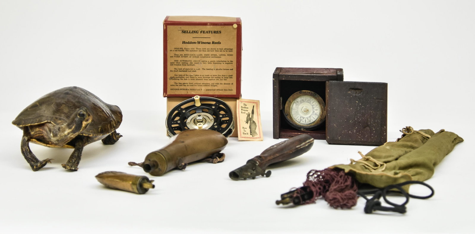 Taxidermy Turtle etc.: Taxidermy turtle 4"h x 10.5"l; Heddon-Winona Reel; small cased compass; powder horns and cased net