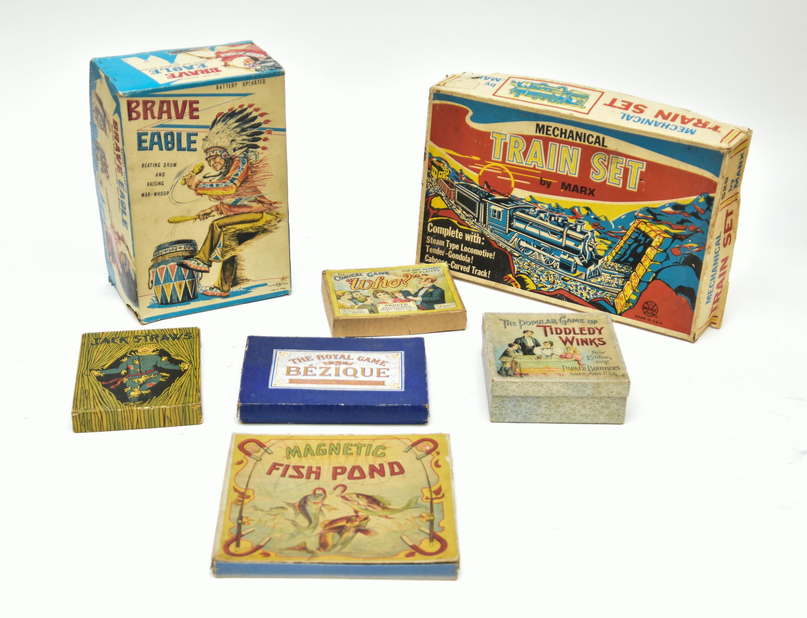 Brave Eagle Toy etc.: Brave Eagle battery operated toy in original box, made in Japan 5.25"h x 12"w; together with Marx train set (incomplete) and five games