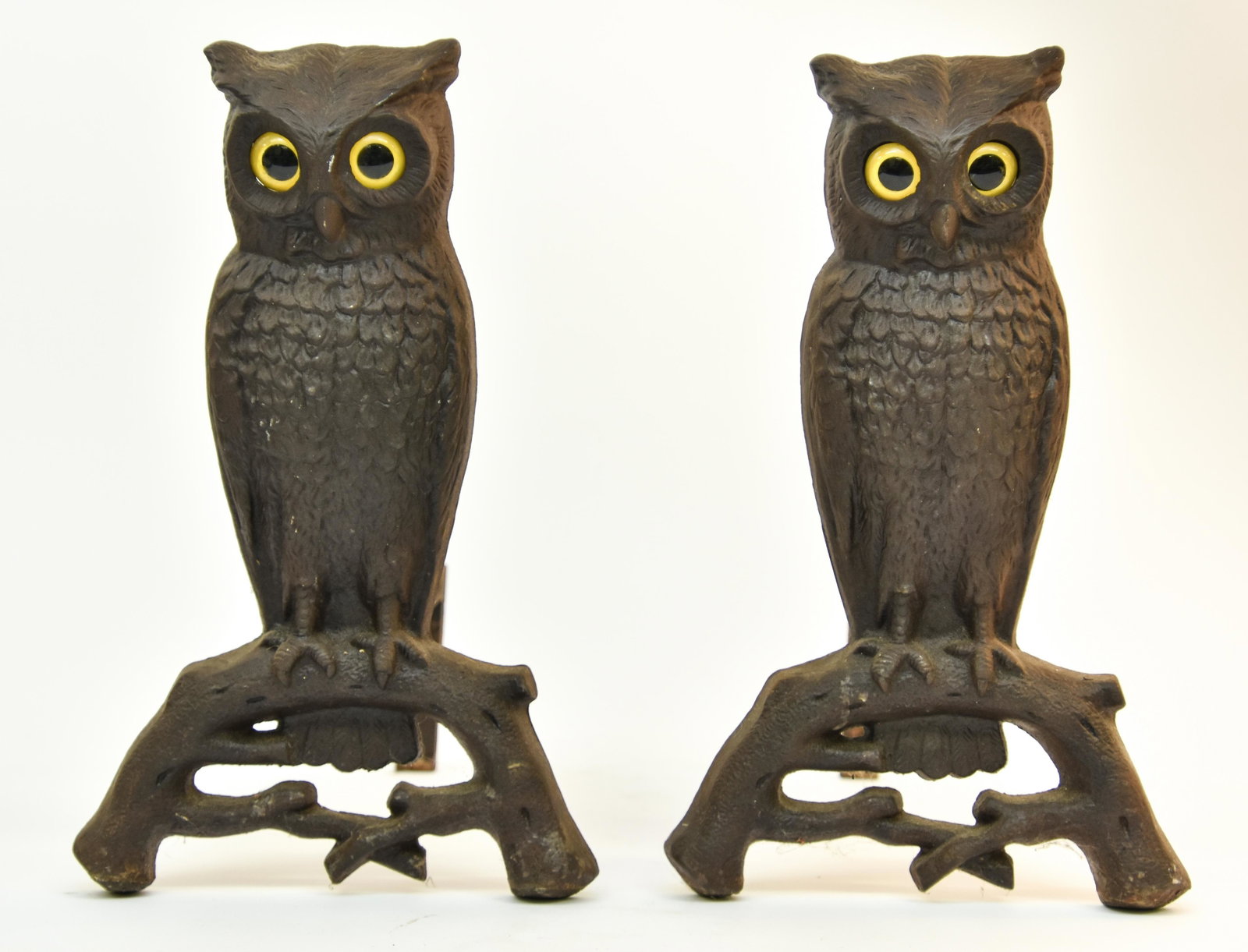 Pair of Cast Iron Owl Andirons: Pair of cast iron owl andirons with glass eyes, late 19th c. 15.25"h x 9"w x 15.5"d