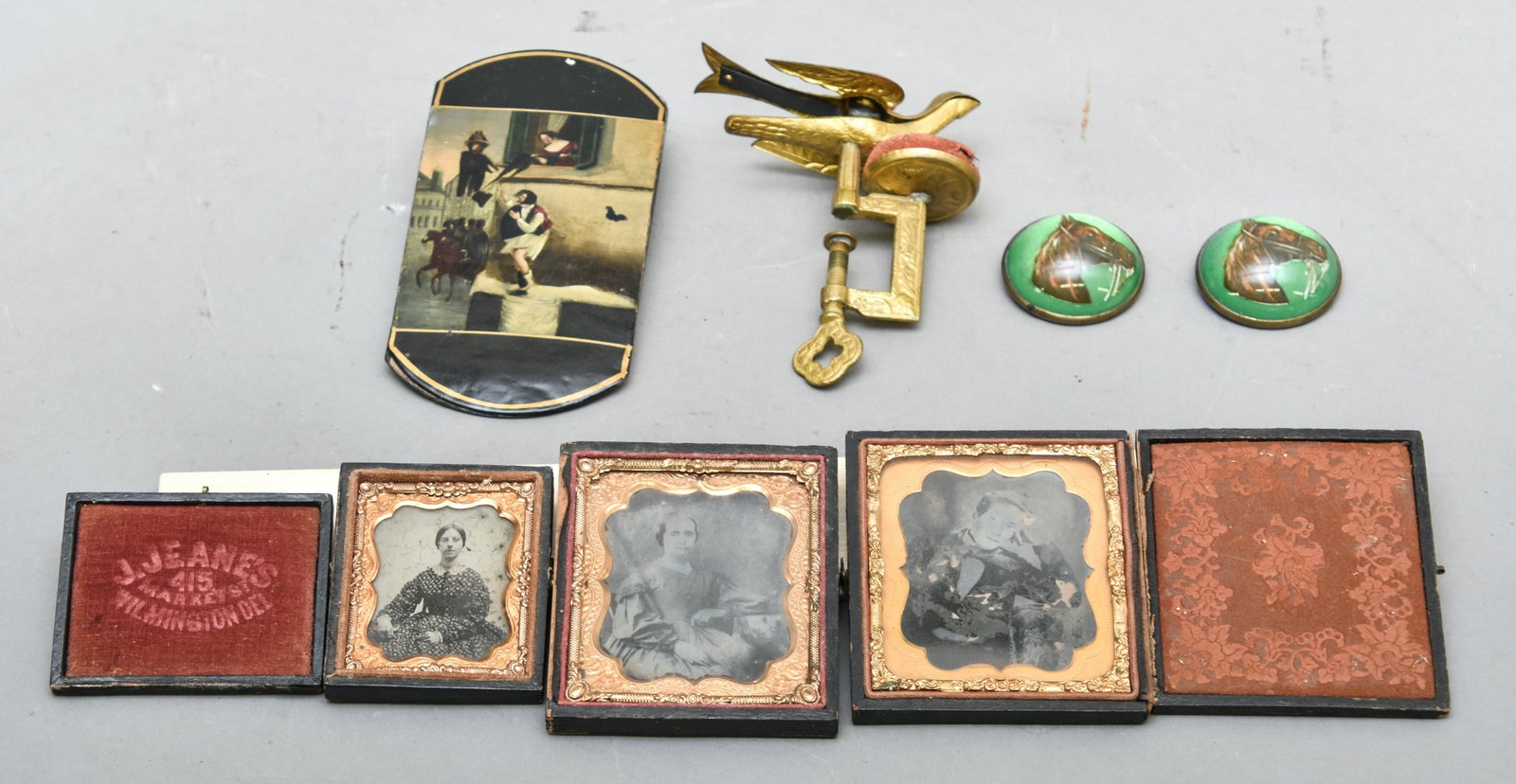 Miscellaneous Grouping: French paper mache painted glasses case 5.5" x 3"; tin types, horse buttons, sewing bird, all 19th c.