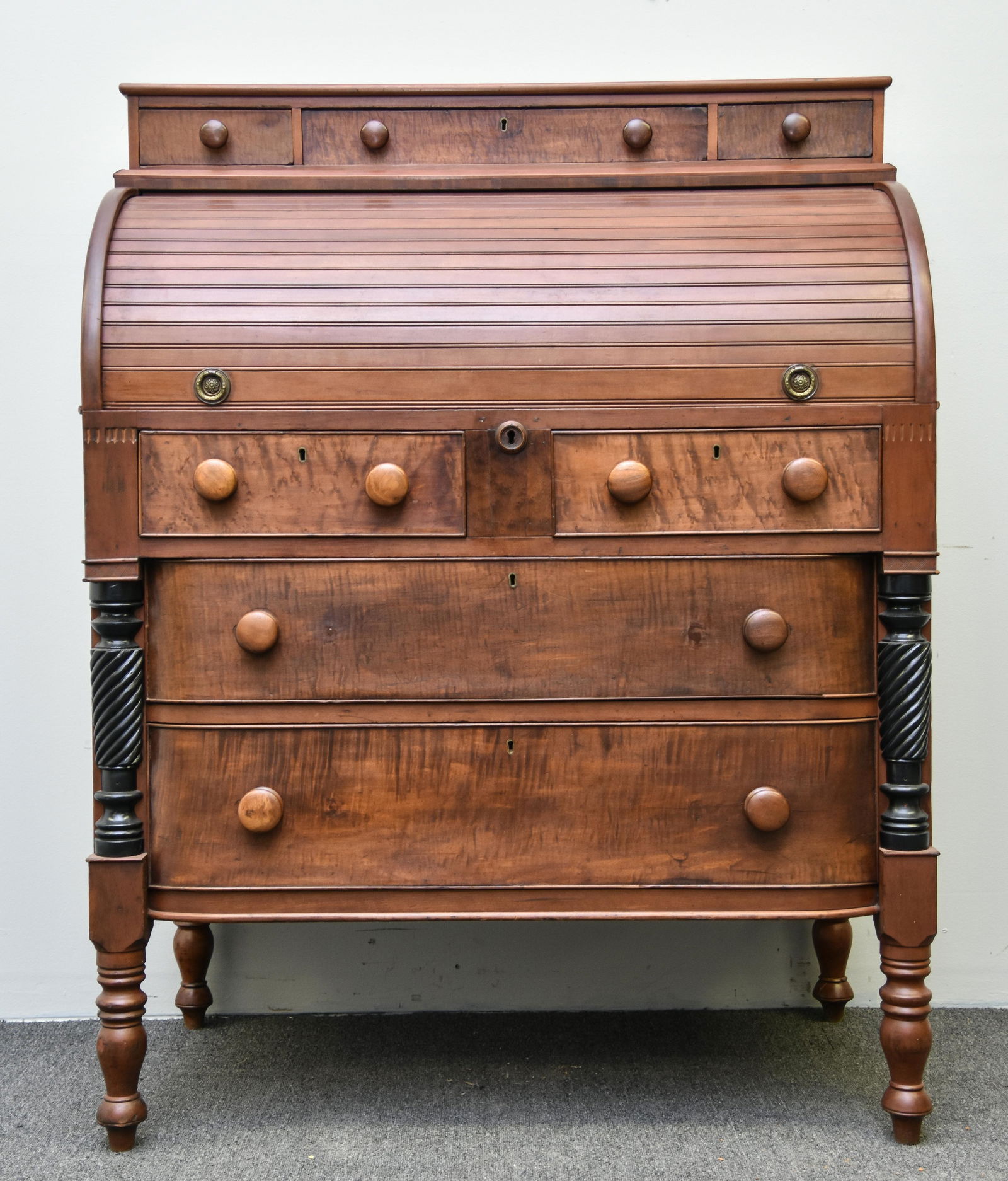 Sheraton Roll Top Desk: Sheraton cherry and maple cylinder roll top desk, circa 1830 with bow-front drawers 53"h x 40.25"w x 23"d