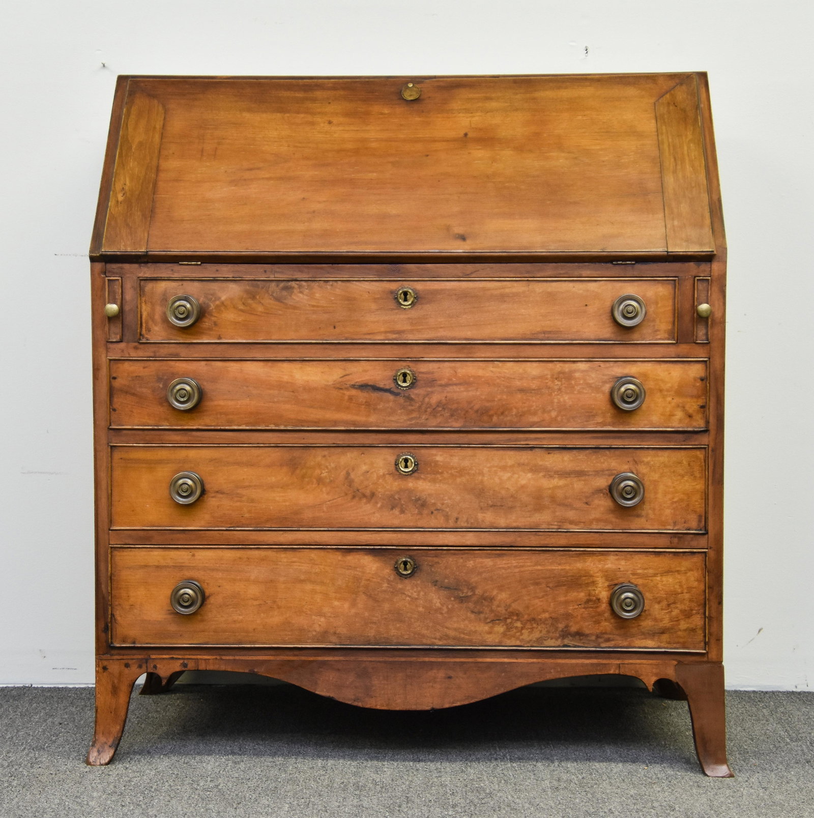 Pennsylvania Hepplewhite Desk: Pennsylvania Hepplewhite walnut slant lid desk, circa 1790 with secret interior compartment and flaring French feet 44.5"h x 39.5"w x 21"d