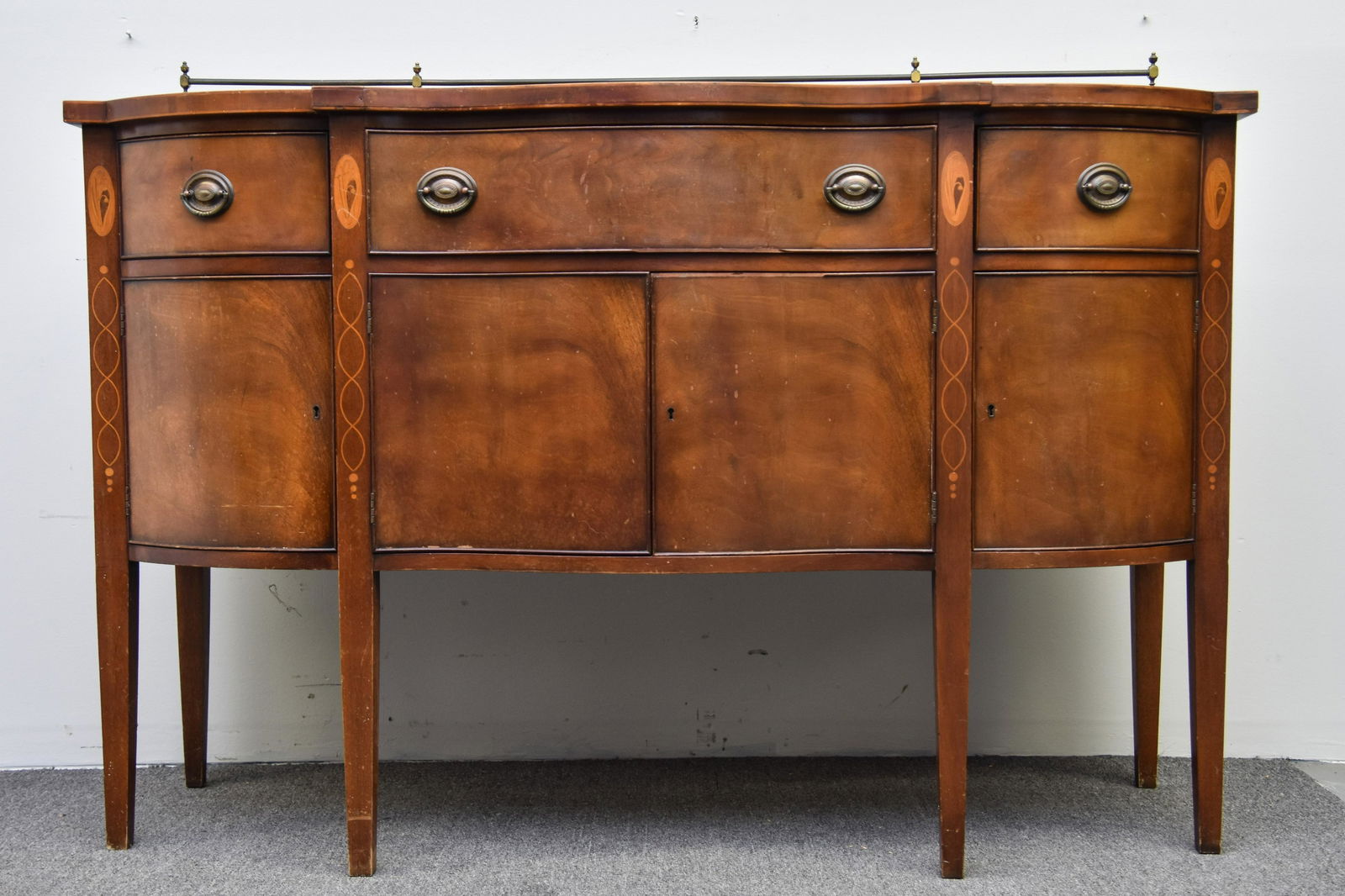 Hepplewhite Style Sideboard: Wallace Nutting Hepplewhite style mahogany inlaid sideboard with brass back rail 40"h x 61"l x 22"d