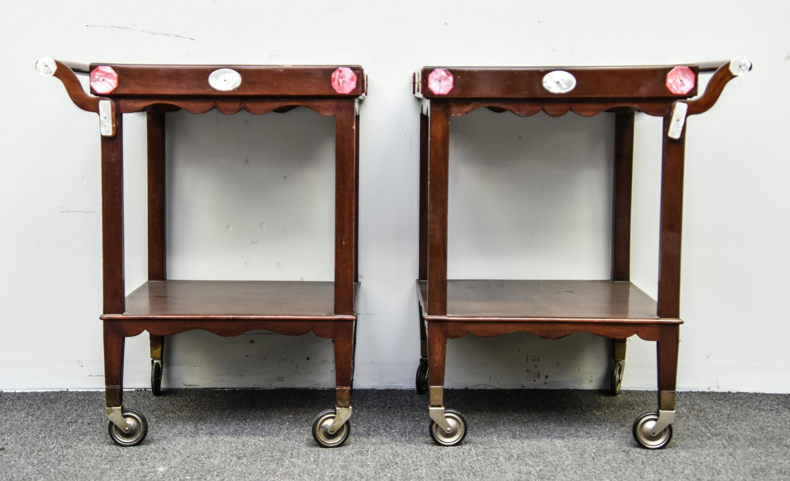 Pair of Baker Serving Carts: Pair of Baker Furniture mahogany serving carts with ornamentations of faux mother-of-pearl 29"h x 20"w x 20"d