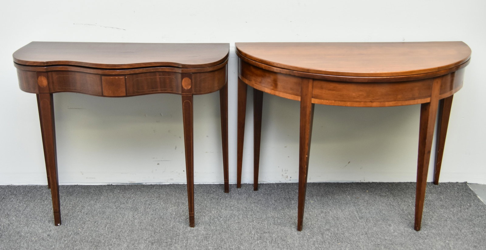 Card Tables: Reproduction Hepplewhite style demi-lune mahogany card table 30"h x 42"w x 21"d (closed); together with a Philadelphia style mahogany card table