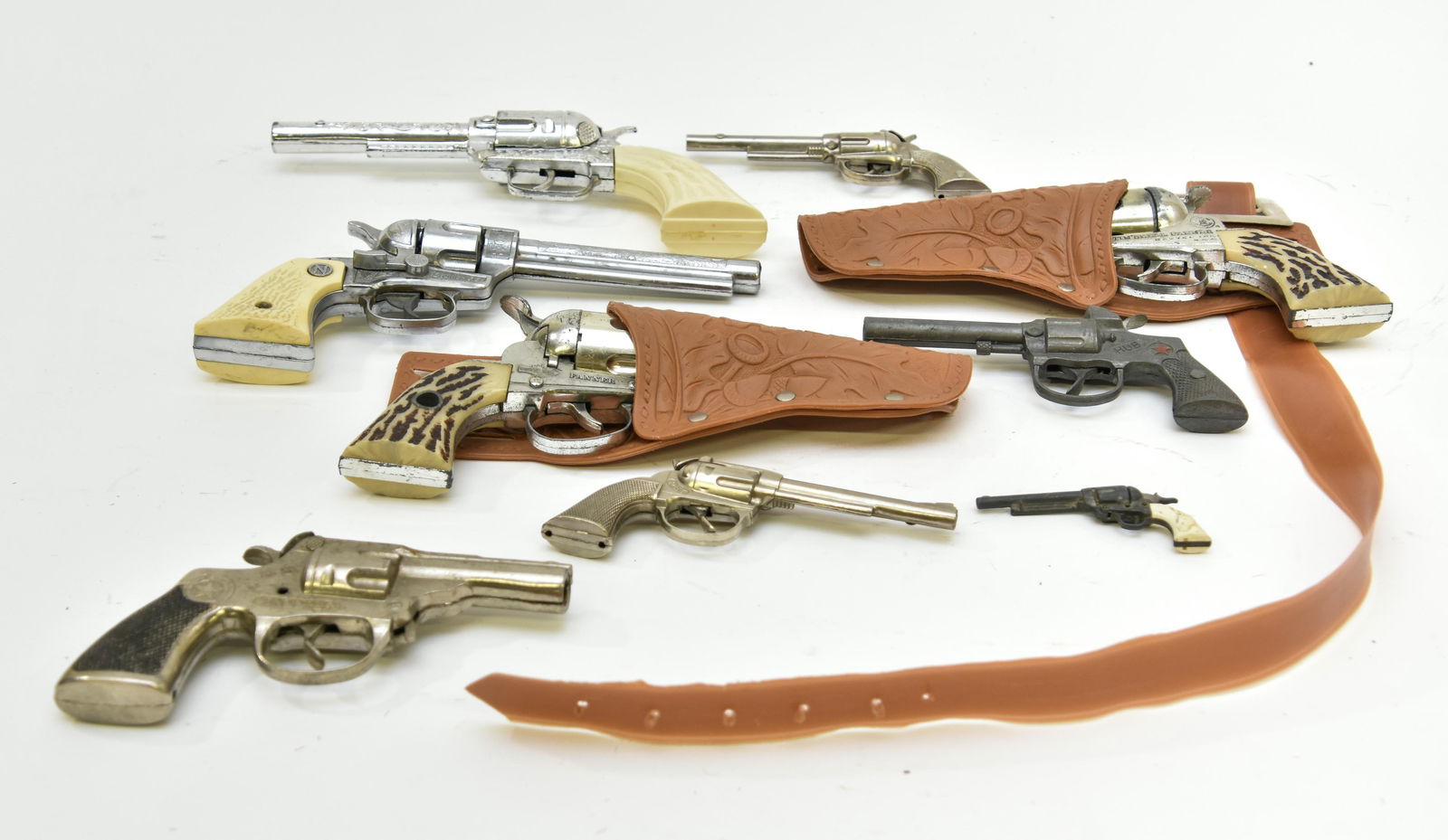 Pair of Cap Pistols etc.: Pair of Mattel Shootin' Shell pistols 9"l with holsters; together with a Nichols Stallion .38, two small 'Pet' pistols etc.