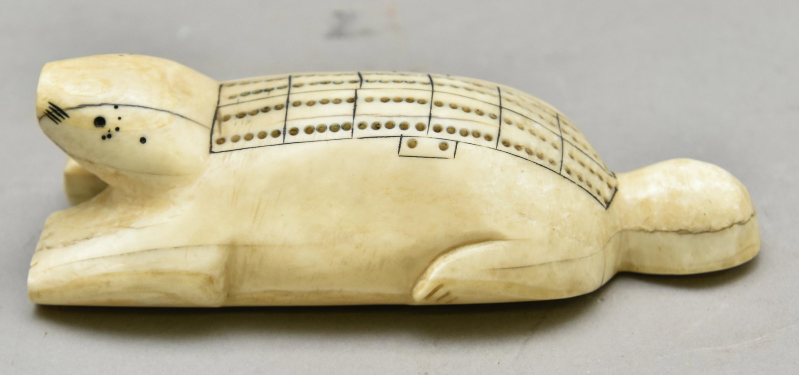 Inuit Carved Cribbage Board: Inuit carved cribbage board, late 19th c.1.5"h x 5.25"l