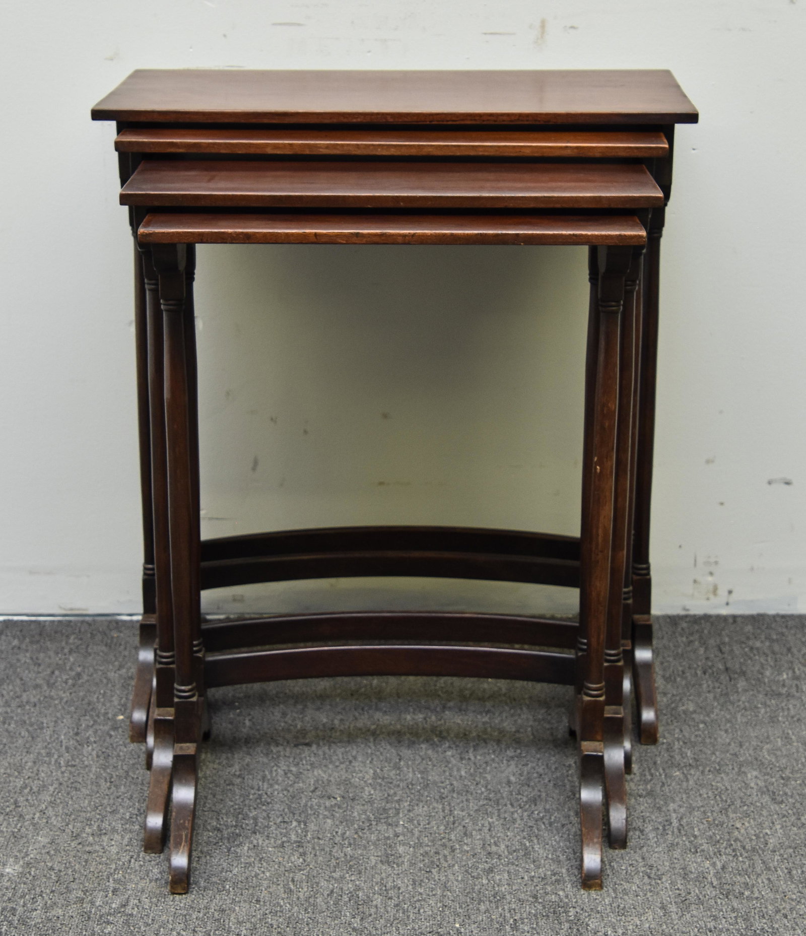 Sheraton Style Nesting Tables: Sheraton style set of four mahogany nesting tables, 20th c. Tallest 27"h x 24"w x 12"d
