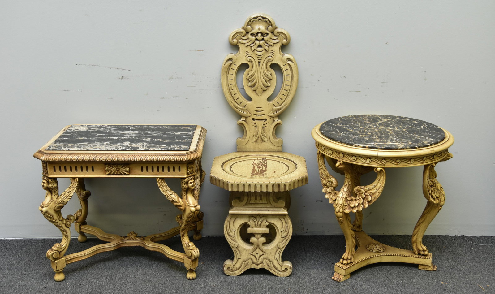 Two Italian Style Painted Tables: Two Italian style painted tables each with black marble tops, and carved birds, largest 23"h x 26"w x 19"d; together with an oak chair 41.5"h
