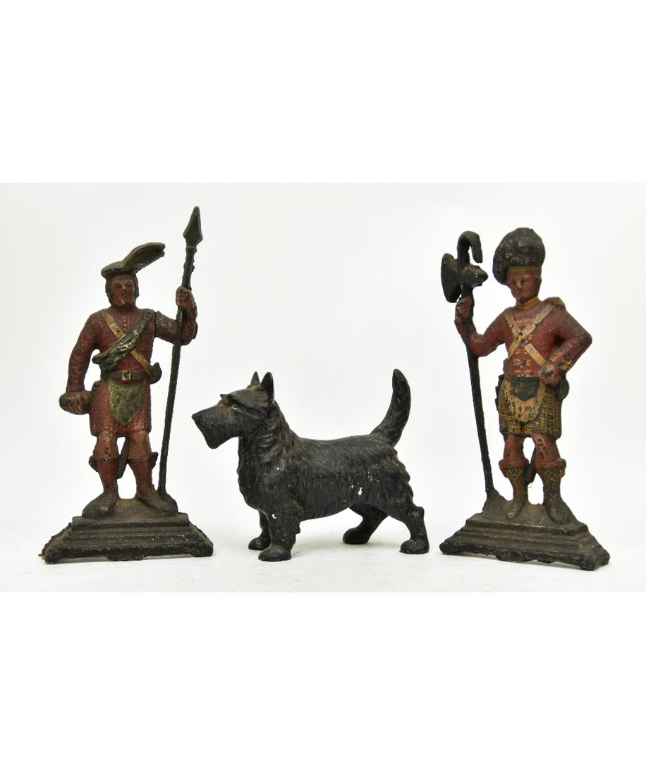 Pair of Cast Iron Beefeater Door Stops etc.: Pair of cast iron Beefeater Scottish door stops (repainted and repaired) 16"h x 7.25"w x 2.5"d; together with an early iron Scottie 10.5"l