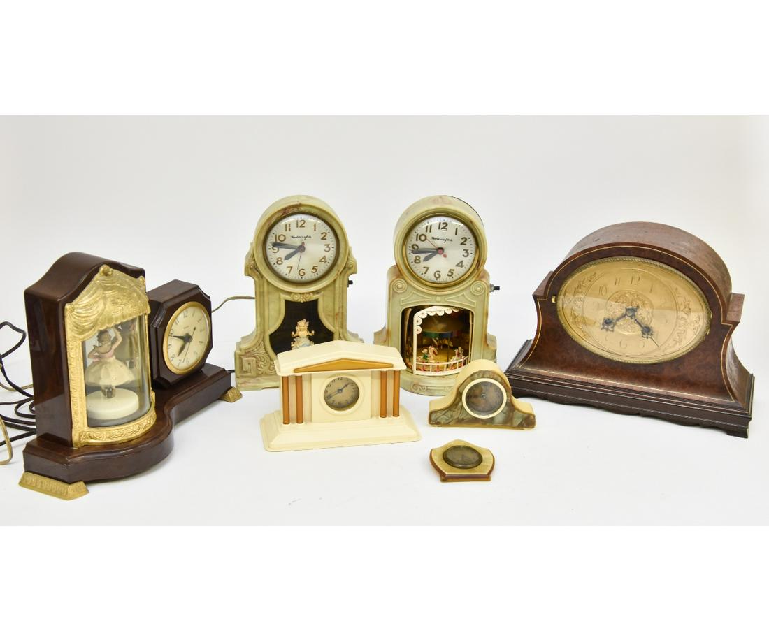 Seven Celluloid Table Clocks: Seven wood/plastic/celluloid table clocks, the largest by Franz Hermile Germany 10"h x 13"w