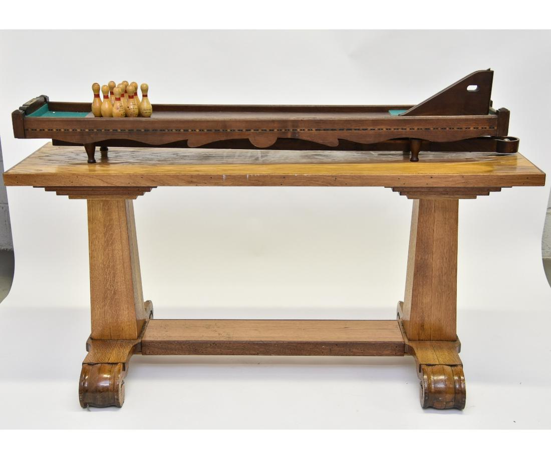 Parlor Table Top Bowling Table: Parlor walnut inlaid table top bowling game with brass level and movable ramp, mounted on an oak base of a later date, bowling pins are marked and signed by the winners Game: 7"h x 65"l x 12"w