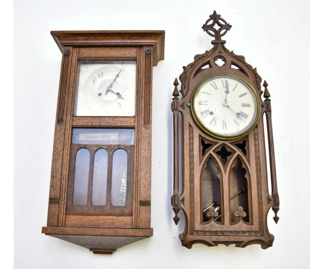Arts & Crafts Calendar Clock etc.: Arts & Crafts oak calendar clock; together with a mahogany Gothic clock, largest 27"h x 12"w