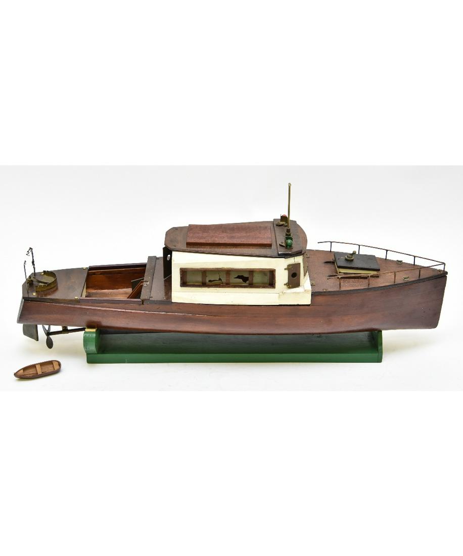 Mahogany Battery Powered Motor Yacht: Mahogany battery operated motor yacht, circa 1950, mounted on a cradle 29"l x 6.5"w / 13"h overall