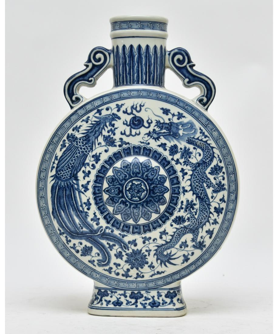 Chinese Porcelain Moon Flask: Blue and white Chinese porcelain moon flask decorated with dragons and birds, probably 20th c. 19"h x 13"w x 4"d