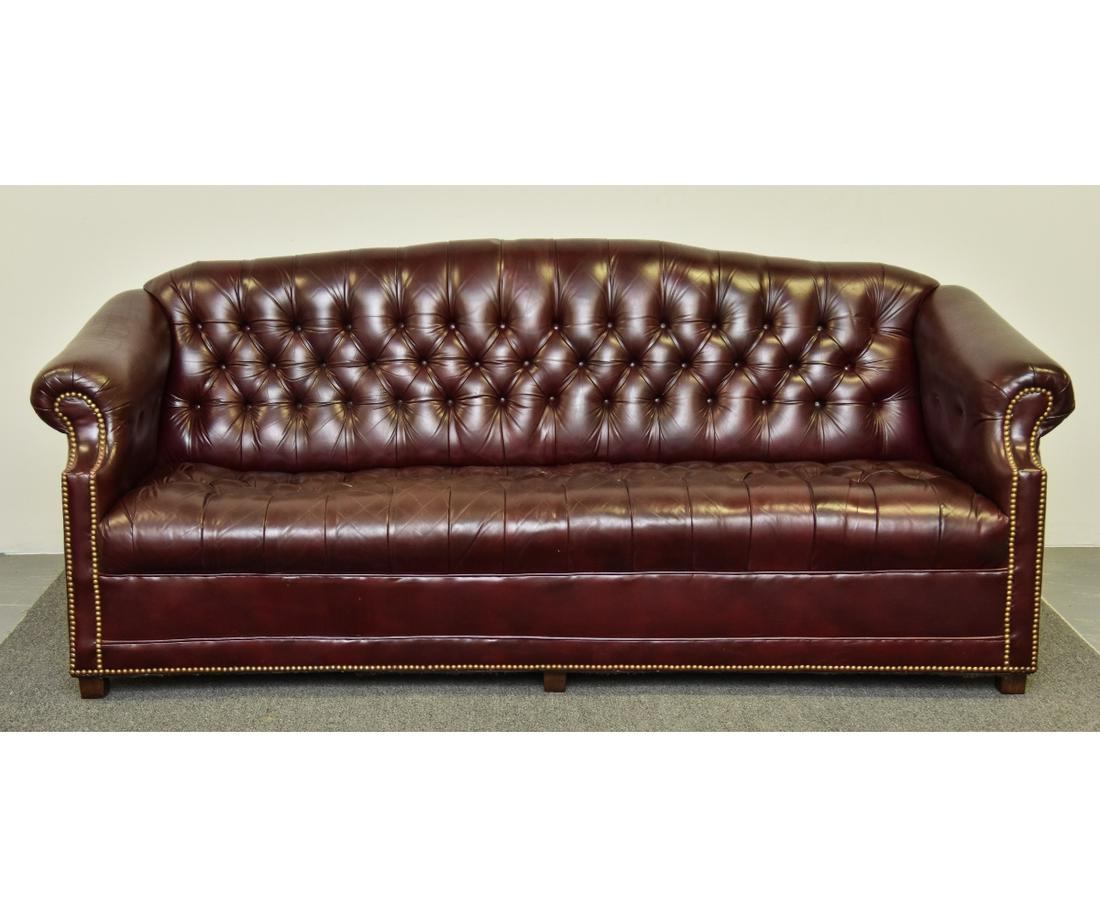 Chesterfield Sofa: Red leather Chesterfield sofa with brass studs 35"h x 82"w x 32"d / seat height = 16"h