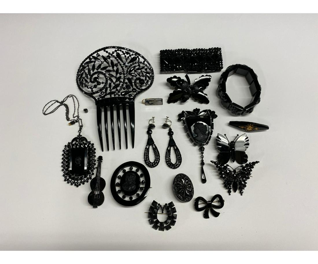 Victorian French Jet and Vauxhall Jewelry: Fifteen pieces of French jet and Vauxhall jewelry and hair accessories to include a chain necklace with pendant (chain is damaged), a glass bead hair comb (6" x 4.5"), two stretch bracelets, a pair of