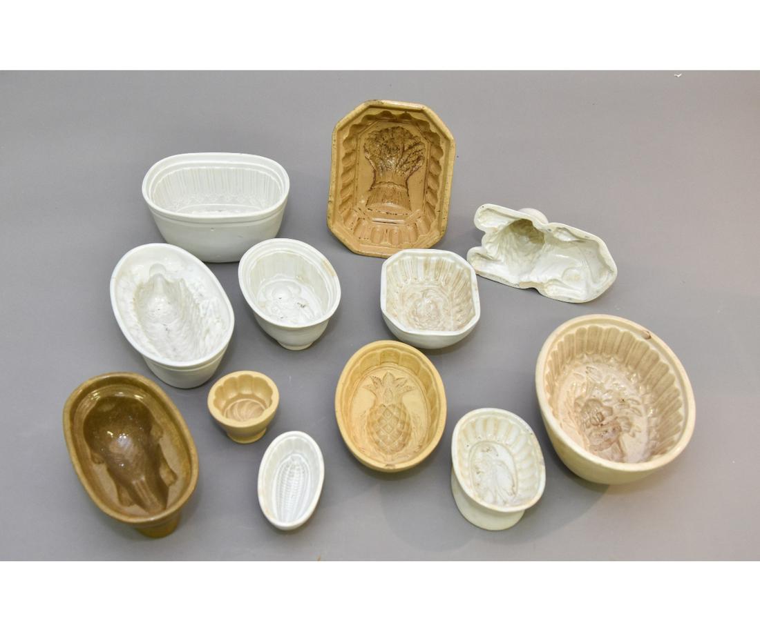Twelve Ironstone Culinary Molds: Twelve yellow ware ironstone, ceramic culinary molds Largest sheaf of wheat 3.5"h x 8.75"w