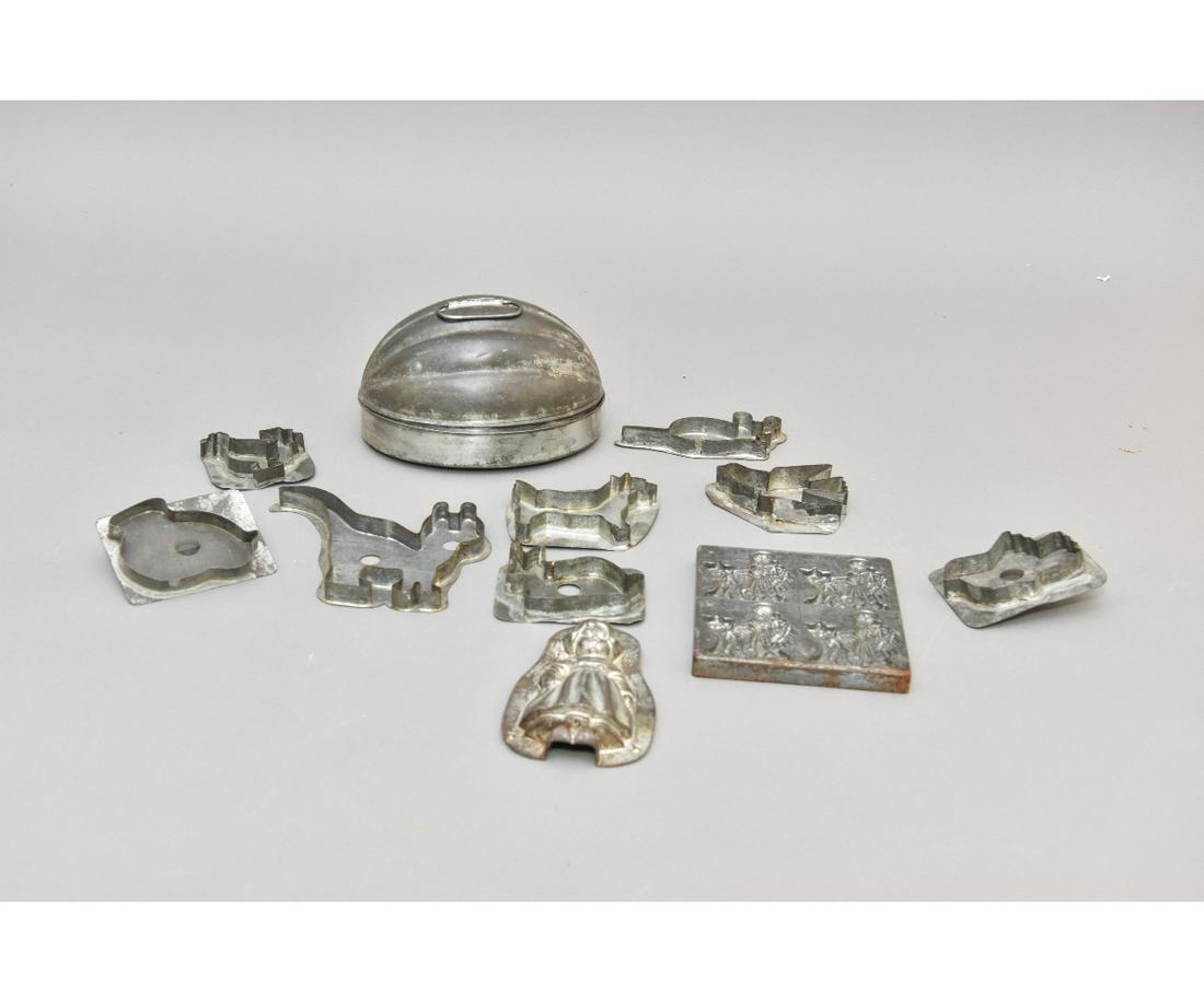 Tin Cookie Cutters and Molds: Eight tin cookie cutters; together with three molds one of Little Red Riding Hood by Anton Reiche, Dresden 5.75"w x 5.5"h