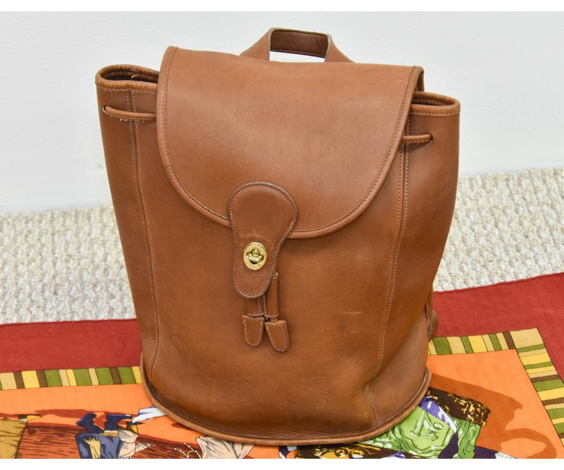 Coach Leather Bag and Hermes Scarf: Light brown Coach leather backpack; together with a large cashmere and silk Hermes scarf Backpack = 14"w x 13" x 13"h Scarf = 54" x 54"