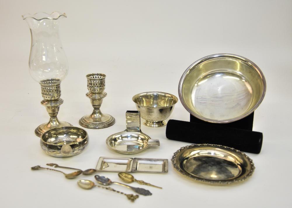 Grouping of Sterling Silver Tableware: Grouping of sterling silver tableware to include a pair of weighted candlesticks, a bowl, a porringer, souvenir spoons etc. Total Troy ounces = 40 Candlestick with globe = 10.5"h
