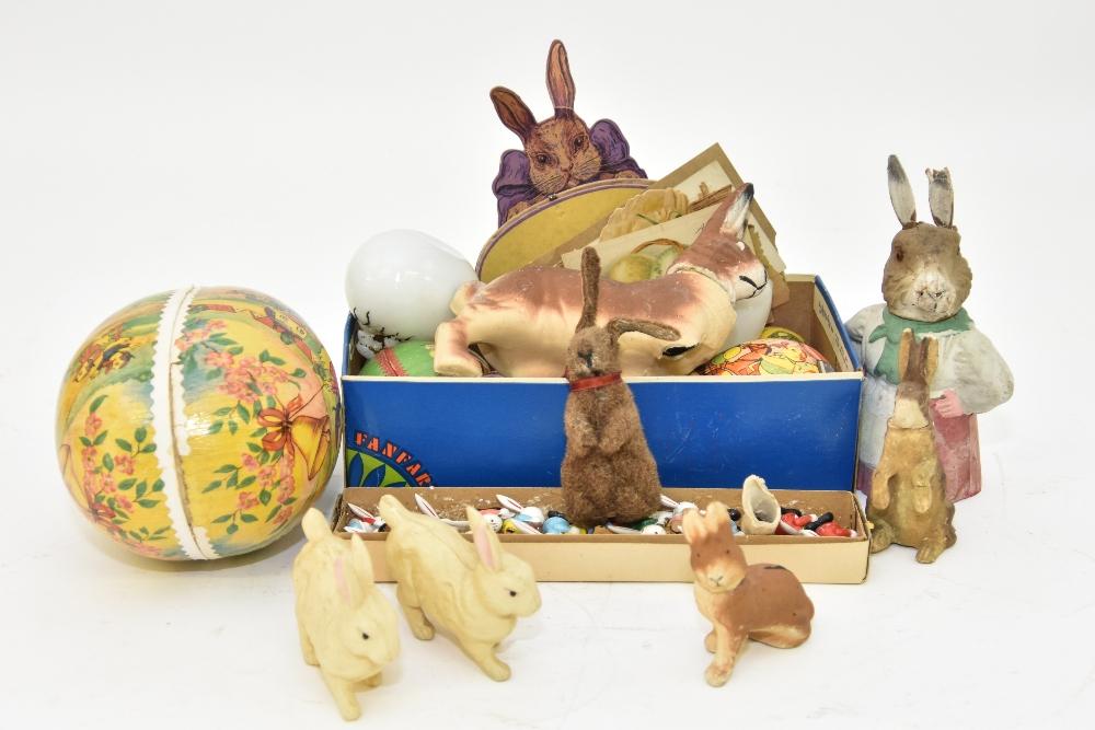 German Paper Mache Easter Eggs etc.: German paper mache Easter eggs, largest 7.5" x 5.5"; rabbit candy containers, largest with damaged leg 7"h x7"l; small wood rabbits from Japan 1.5"h; Easter cards, etc.